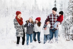 Family laughing in winter