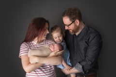 Beautiful new family of four taken at Kimberly Kendall Photography's studio